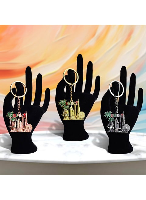 Premium Dubai Metal Keychain Set (3 pcs) featuring Dubai Museum, Ain Dubai, Burj Khalifa, and Palm Tree designs. One elegant design in three vibrant colors—perfect as a giveaway gift, everyday accessory, or the best Dubai souvenir.