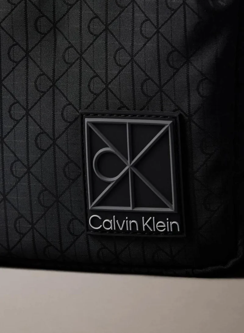 Calvin Klein Black Allover Emblem Logo Jacquard Reporter Bag for Men | Best Price UAE