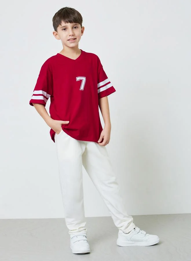 Styli Teen Boys Red V-Neck Varsity Stripes Sleeves Oversized T-Shirt