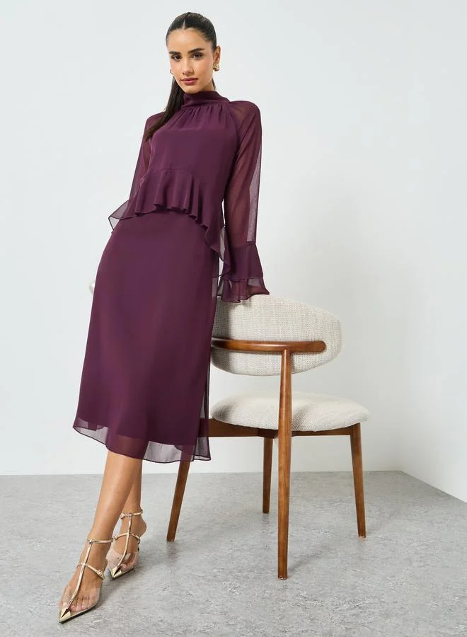 ستايلي فستان ميدي أرجواني بأكمام جرس وتفاصيل كشكش