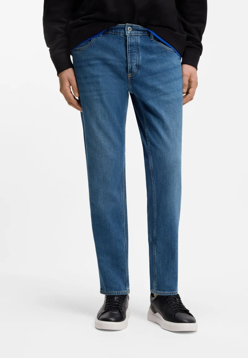 هوجو جينز بقصة مستدقة من دينم مطاطي أزرق متوسط