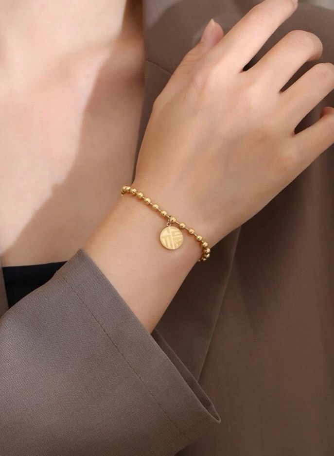نونز أب اسوارة أنيقة مطلية باللون الذهبي عيار 18 - Image 1