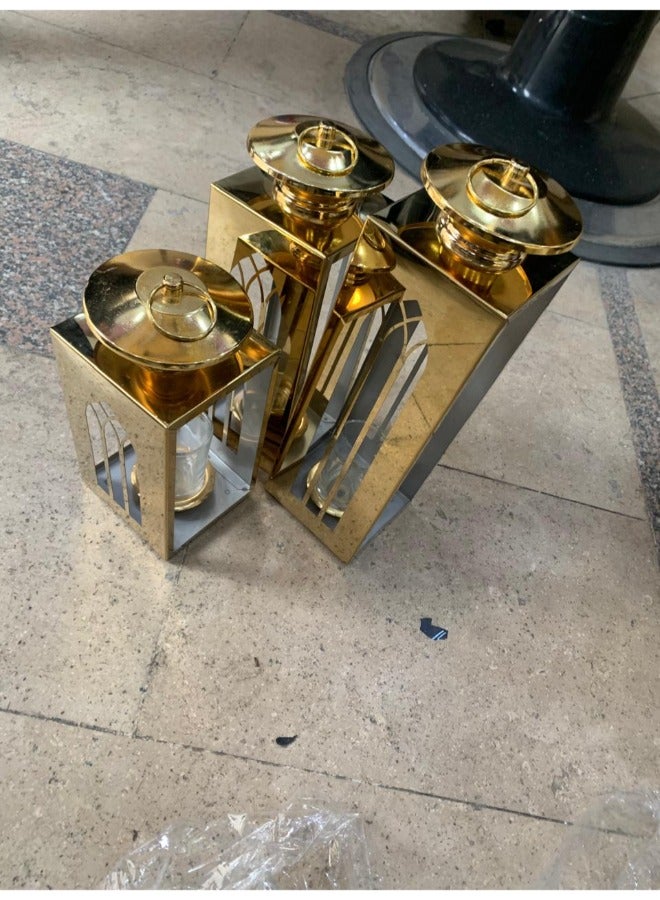 "An elegant set of golden lanterns in three different sizes – a perfect decorative addition to your home during Ramadan and special occasions. Luxurious design without a candle for a uniqu  - Image 1