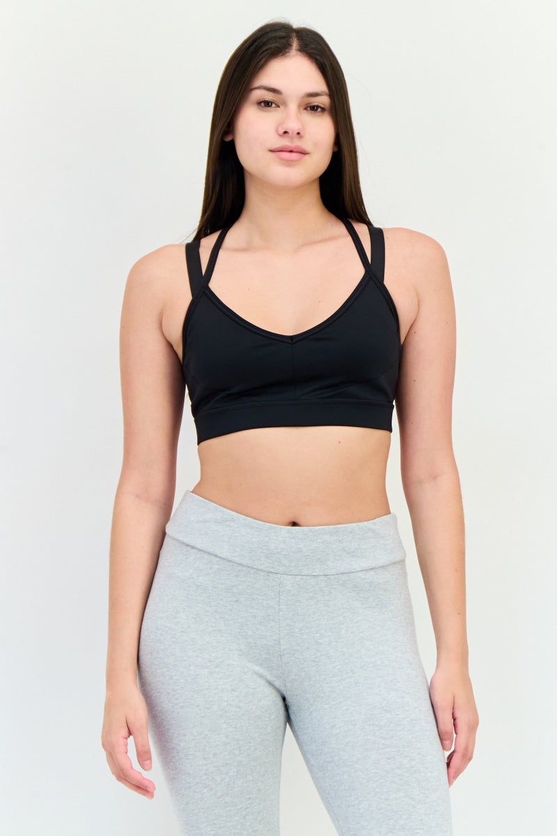 PUMA سوتيان رياضي خفيف مبطن بشعار العلامة التجارية للنساء، أسود - Image 1