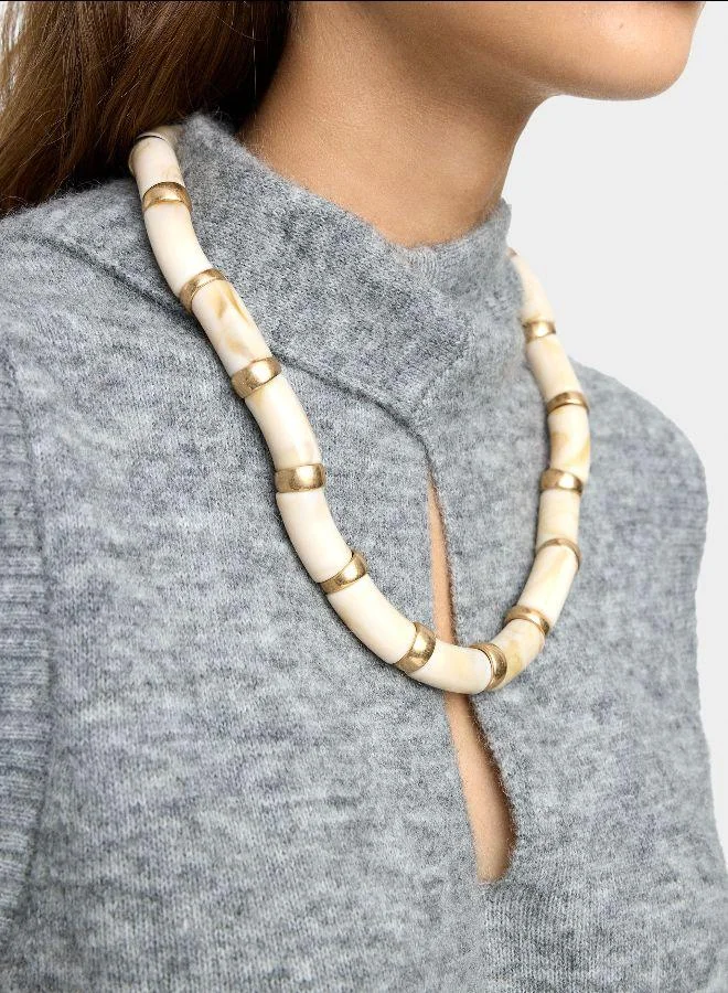 بارفوا عقد قصير مقطع مع تأثير حجر