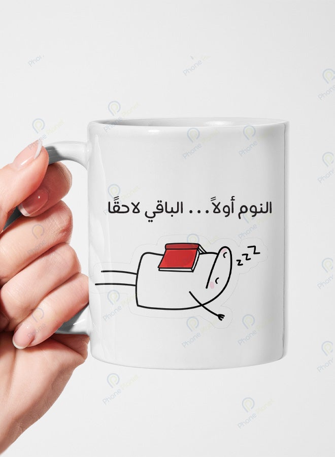 A ceramic mug printed with the phrase Sleep First the Rest Later and featuring a comfortable handle