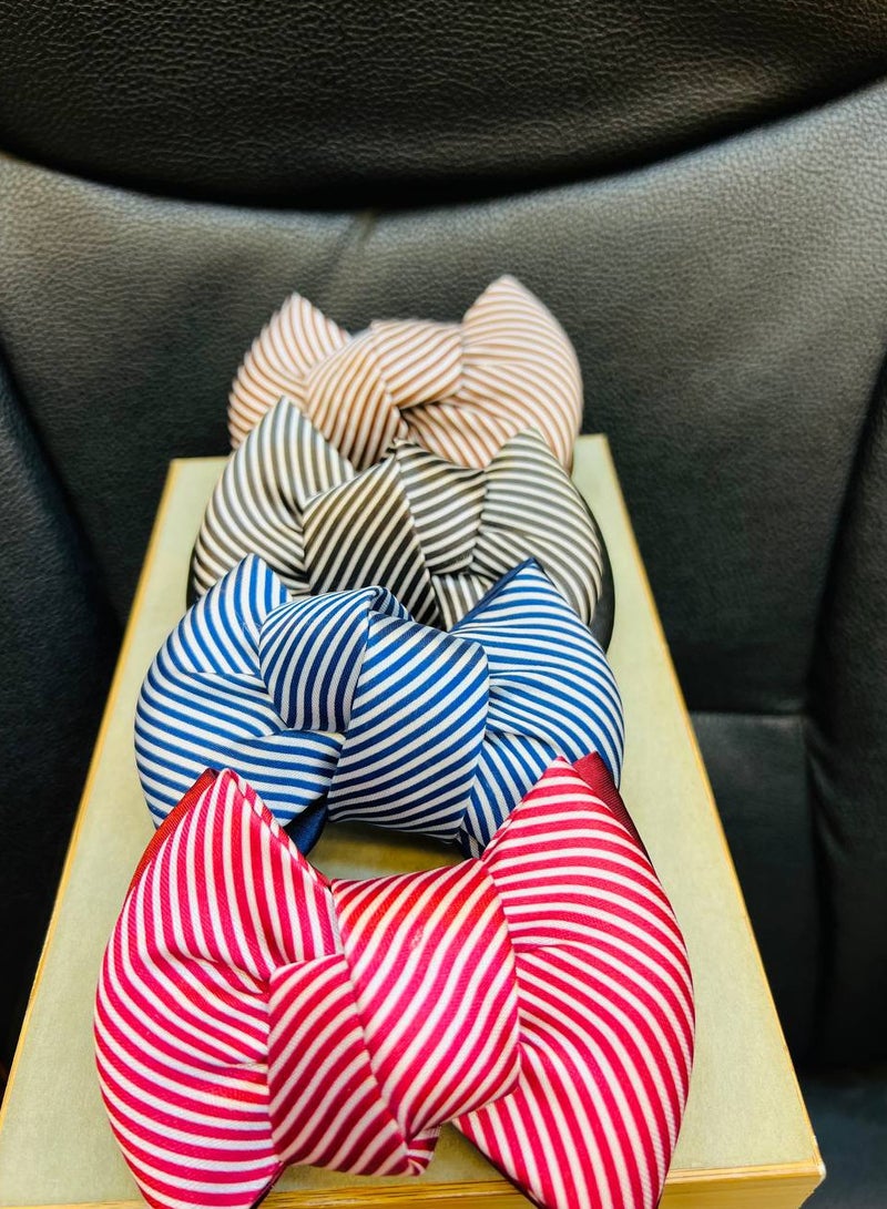 Generic "Beige and white striped bow hair clip, an elegant touch that adds femininity and distinction to your look." - Image 1