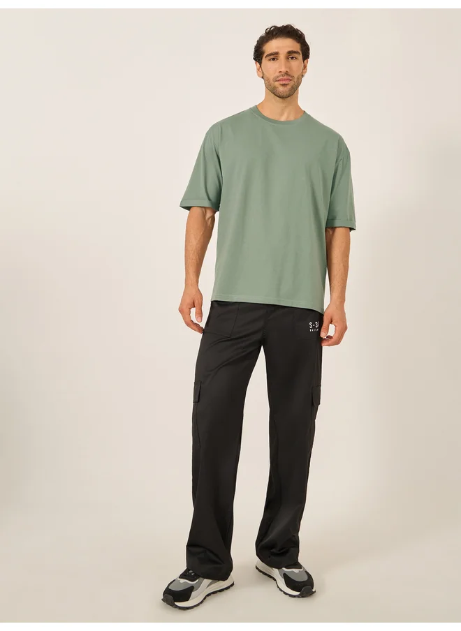 ستايلي Styli Oversized Roll Up Sleeves T-Shirt with Side Slit