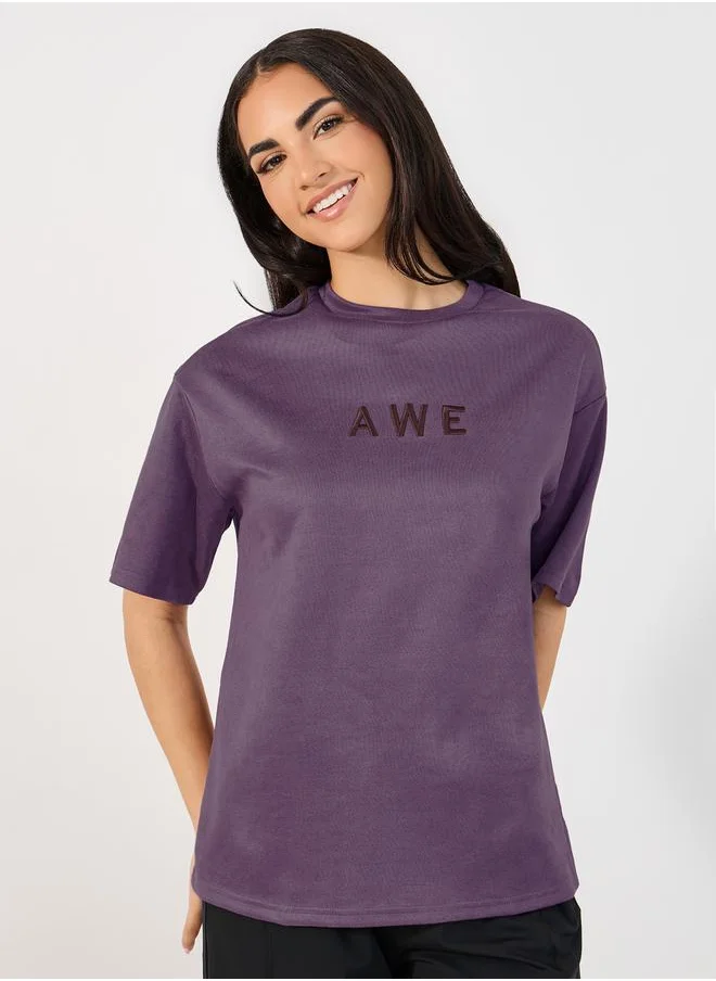 Styli Suede Look Oversized T-Shirt with Embroidered Slogan