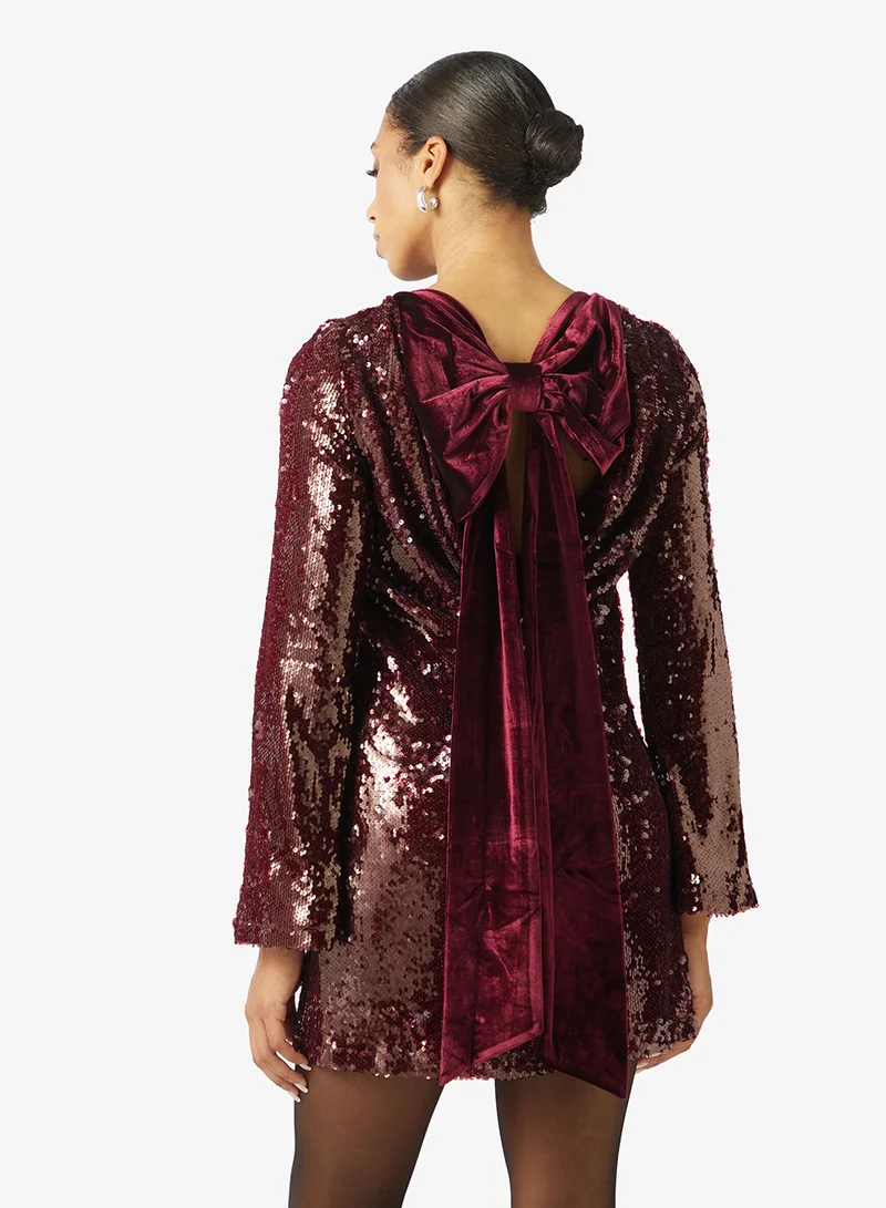 PRETTY LAVISH Brioni Sequin Bow Mini Dress