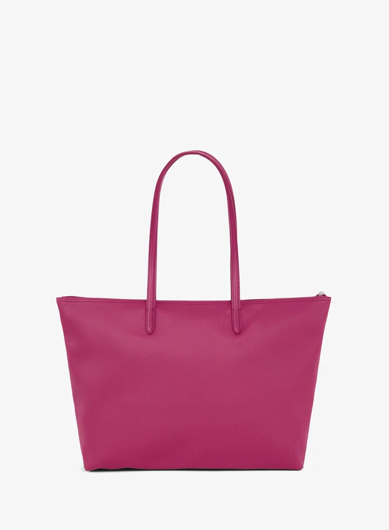 Lacoste  The iconic L1212 style in a large shopping bag for Women | Best Price UAE