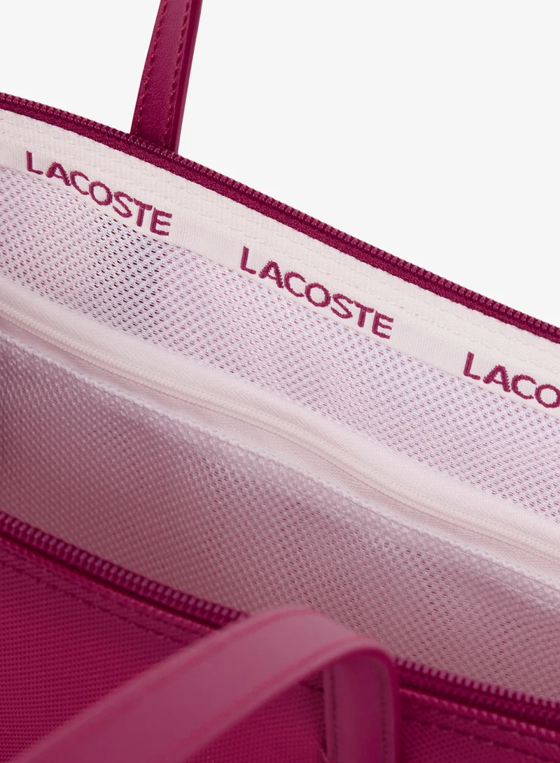Lacoste  The iconic L1212 style in a large shopping bag for Women | Best Price UAE