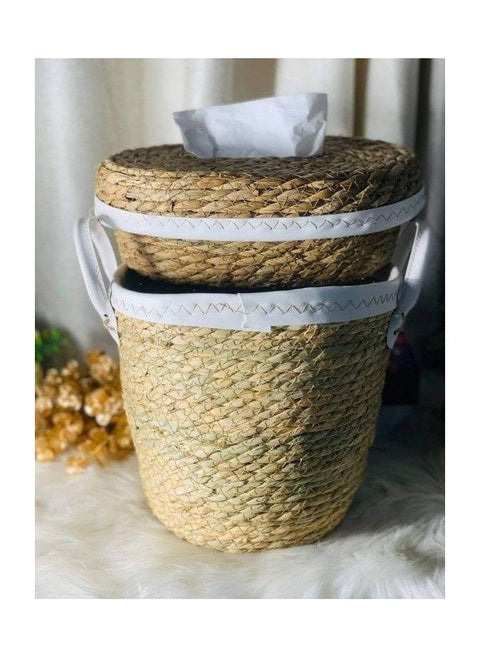 A trash can and a wicker tissue box