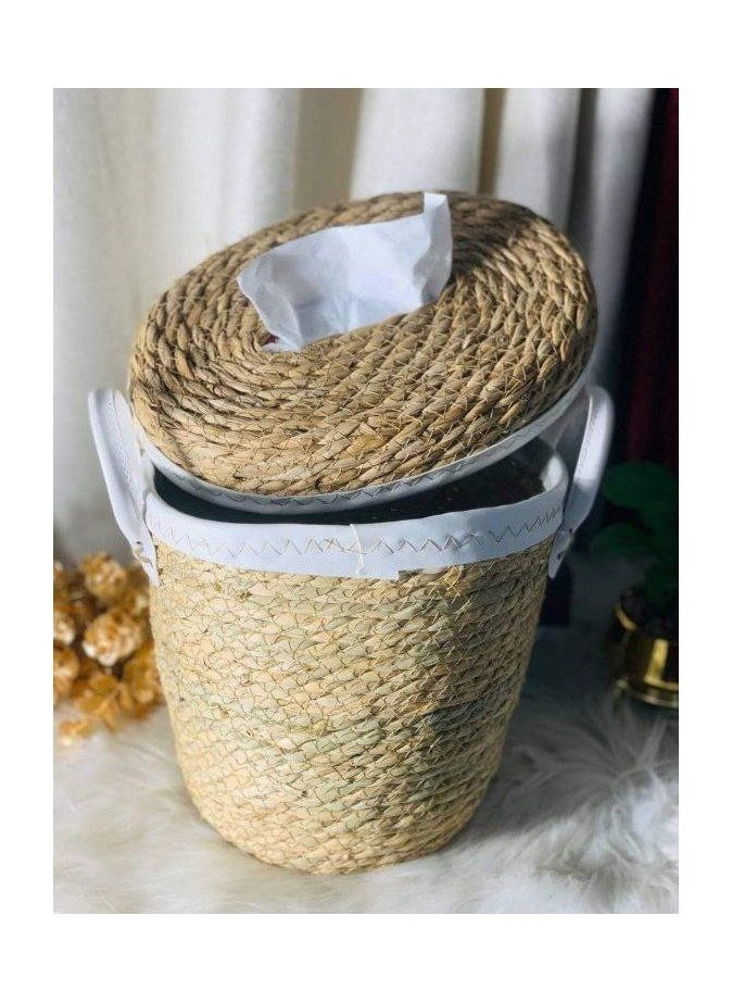 A trash can and a wicker tissue box