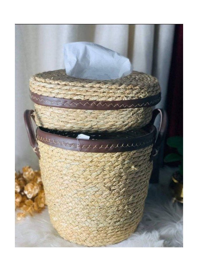 A trash can and a wicker tissue box