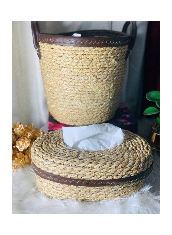 A trash can and a wicker tissue box