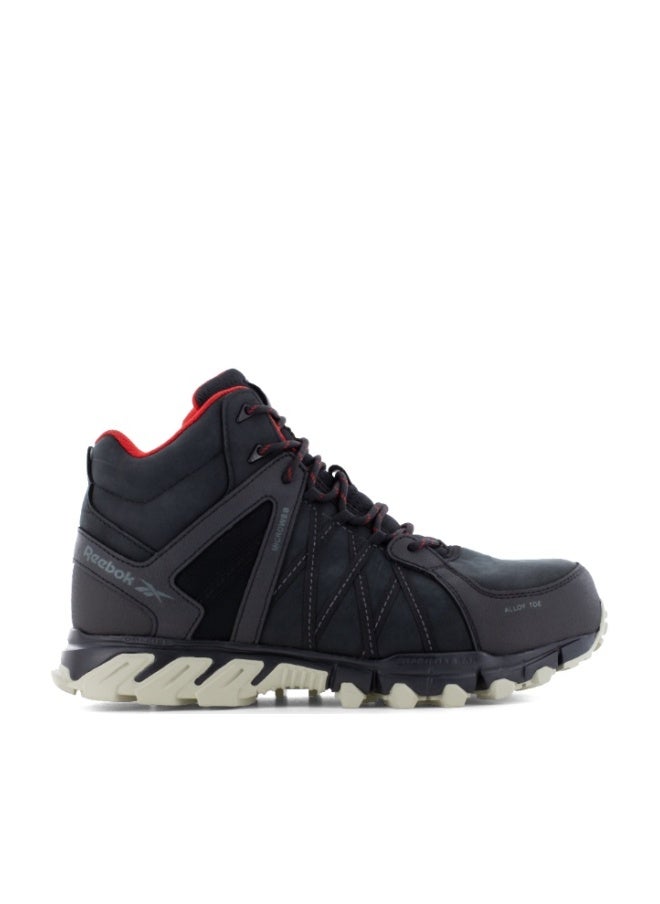 Reebok Work تريل غريب سيفتي | IB1052S3 – أسود، حذاء سلامة قصّة متوسطة بتصميم جري على المسارات بمقدمة ألومنيوم وتوسيد DMXRide ونعل مقاوم للانزلاق SRC - Image 1