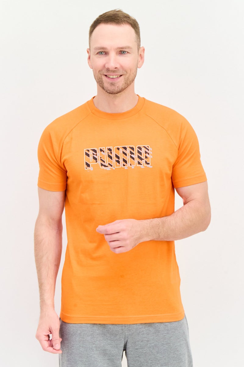 PUMA Men Sportswear Fit Brand Logo Short Sleeves Outdoor T-Shirt, Orange - Image 1