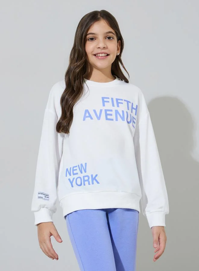 Styli Teen Girls Off White Graphic Print Sweatshirt and Blue Straight Leg Pants Set