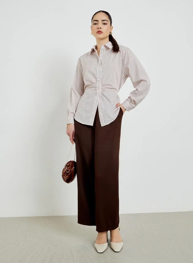 ستايلي قميص مخطط واسع بأكمام طويلة