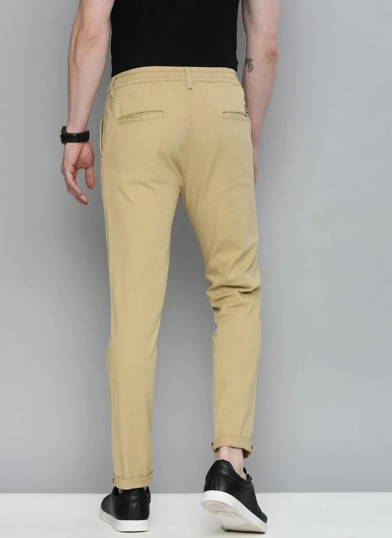 ذا انديان كراج كو Men Slim Fit Solid Mid-Rise Chinos