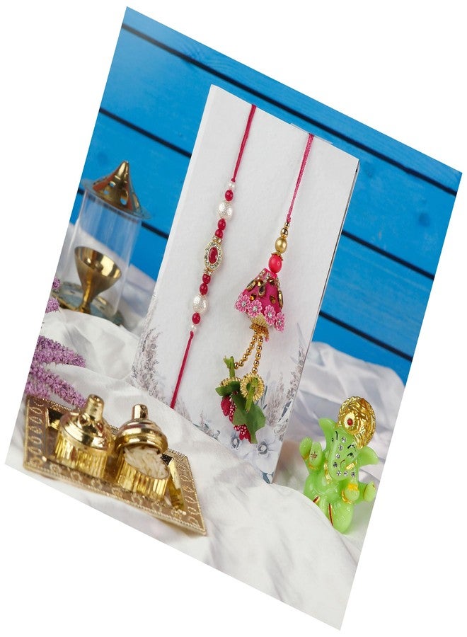 Toris Pack of 2 Rakhi Comes with Tilak set, Greeting card in Elegant Pink Shade – Thoughtful Rakhi Gift with Traditional Charm and Style - Image 1