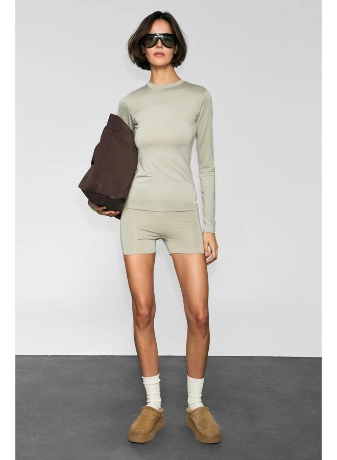 Urban Beat COREX Women's Round Neck Printed-Detail Slim Fit Long Sleeve Sports T-Shirt in Stone Color.