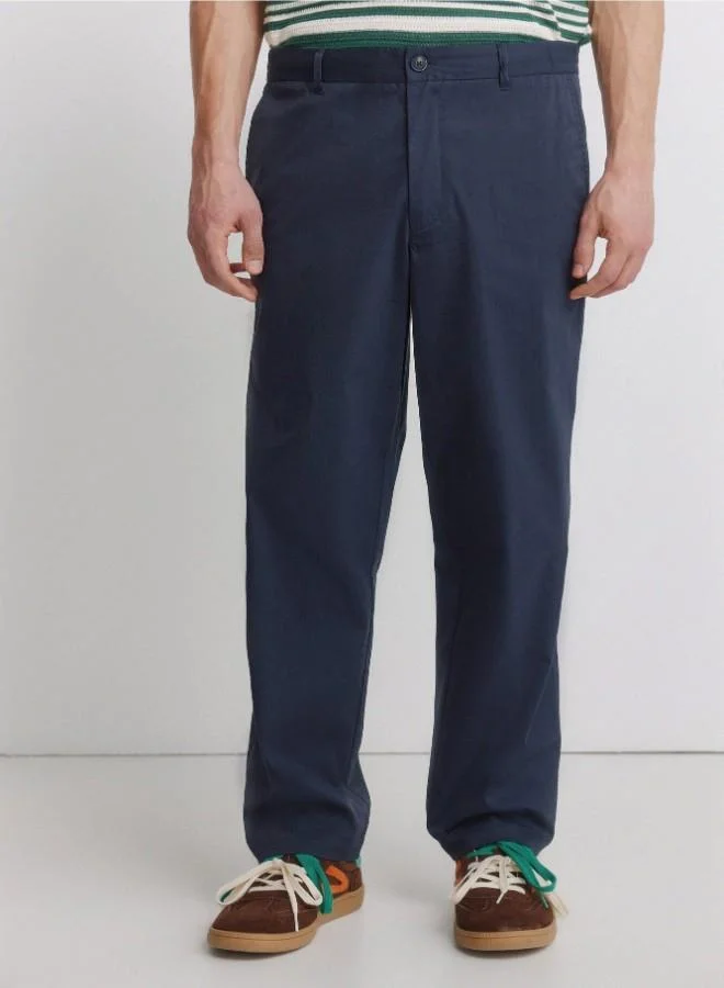 Springfield  Trousers made from a lightweight cotton and nylon blend fabric with stretch, providing comfort. They feature an elasticated waistband on both sides for enhanced comfort, and an inner drawstring for a perfect fit. Back welt pockets with button. Relax fit. for Men | Best Price UAE