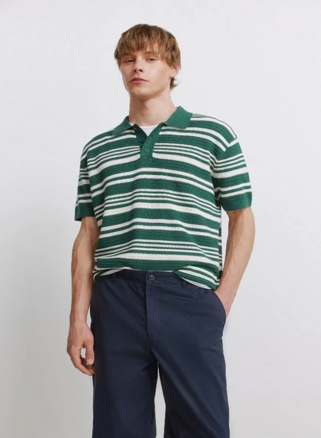 Springfield  Trousers made from a lightweight cotton and nylon blend fabric with stretch, providing comfort. They feature an elasticated waistband on both sides for enhanced comfort, and an inner drawstring for a perfect fit. Back welt pockets with button. Relax fit. for Men | Best Price UAE