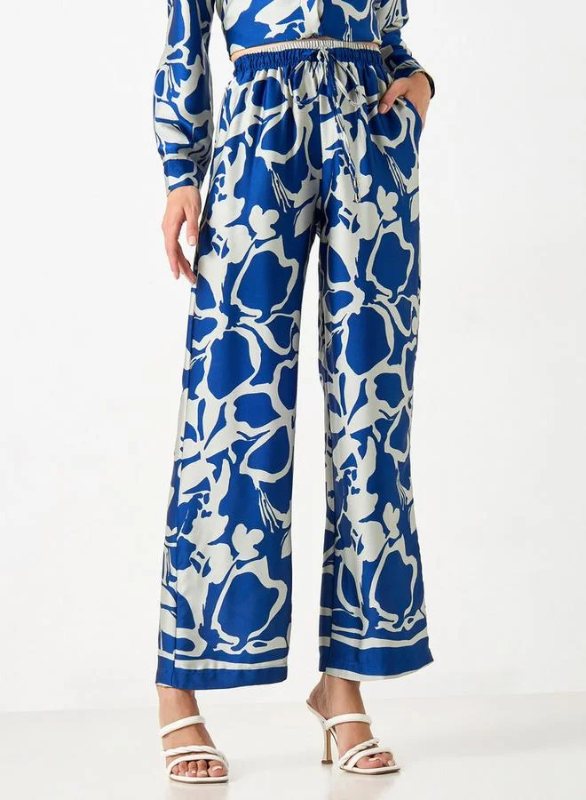 2Xtremz 2Xtremz All-Over Print Wide Leg Pants with Drawstring Closure and Pockets