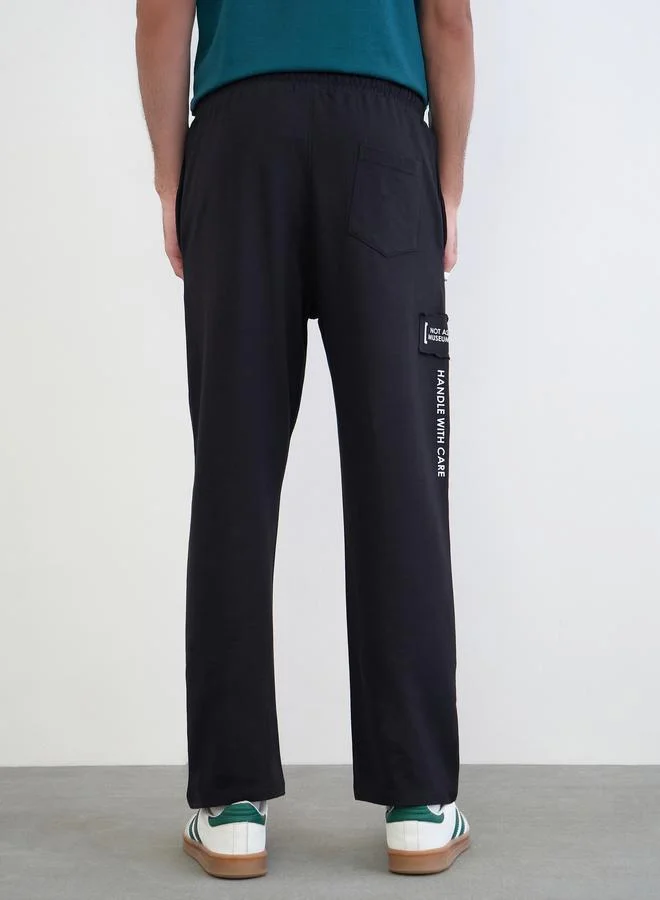 Styli Black Men Applique Patch Detail Oversized Joggers for Men | Best Price UAE