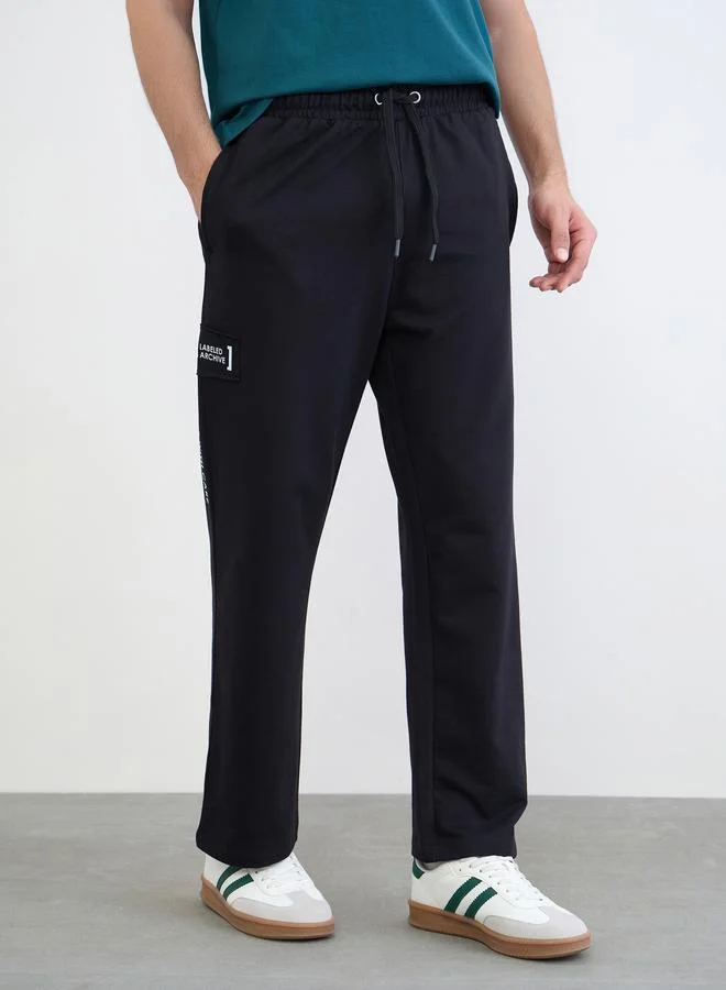 Styli Black Men Applique Patch Detail Oversized Joggers for Men | Best Price UAE