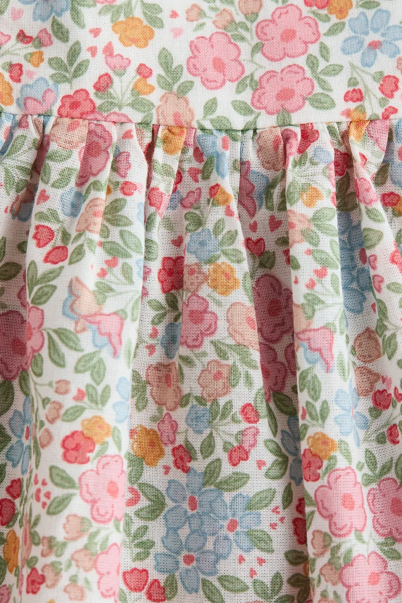 اتش اند ام فستان بتصميم بودي سوت بحواف مكشكشة