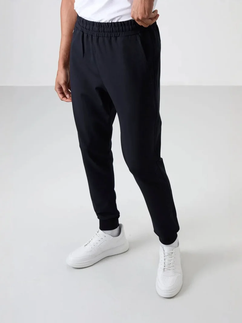 تومي لايف TOMMY Men's Regular Fit Cotton Blend Sweatpants