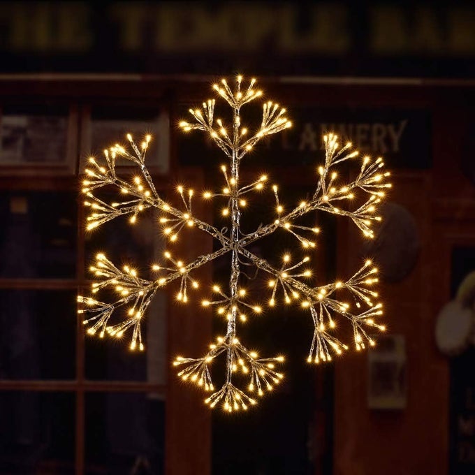 24INCH 240 LED STARBURST SNOWFLAKE LIGHT TWINKLE AND WARM WHITE LIGHTS SILVER FINISH PLUG IN FOR HOME GARDEN DECORATIONWEDDINGBIRTHDAYCHRISTMASHOLIDAYPARTY DECORATION EXTRA SCREWS