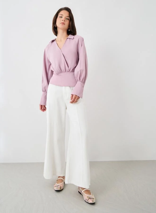 ستايلي بلوزة ملفوفة بأكمام طويلة وياقة وأساور