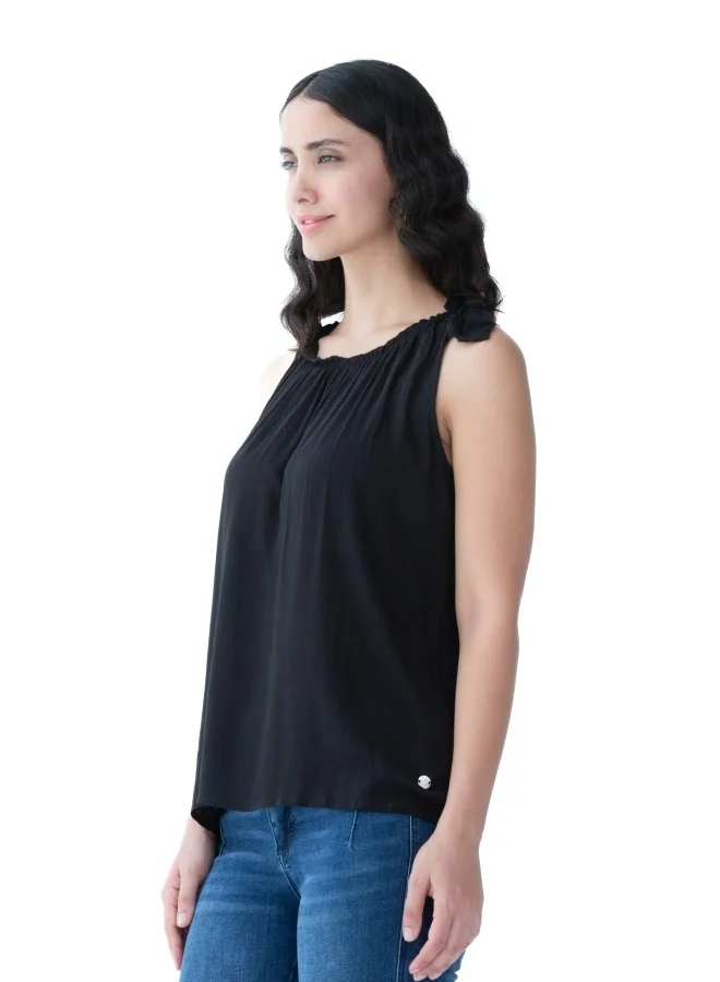 ZABAIONE Versatile black sleeveless top with a gathered neckline, perfect for layering or standalone use.