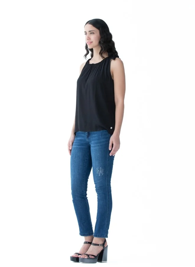 ZABAIONE Versatile black sleeveless top with a gathered neckline, perfect for layering or standalone use.