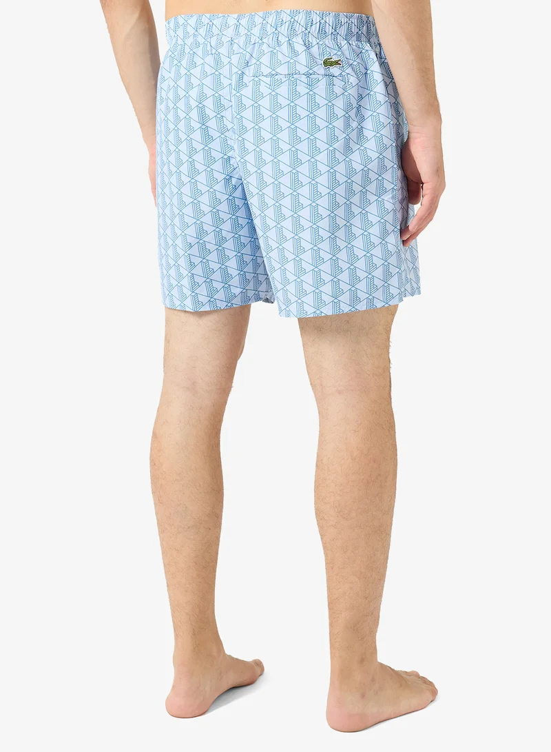 Lacoste  Monogram Print Swim Trunks for Men | Best Price UAE