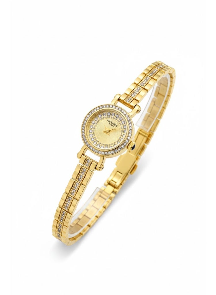 هيرميس ساعة يد نسائية من هيرميس باريس بسوار ذهبي وإطار مرصع بالكريستال