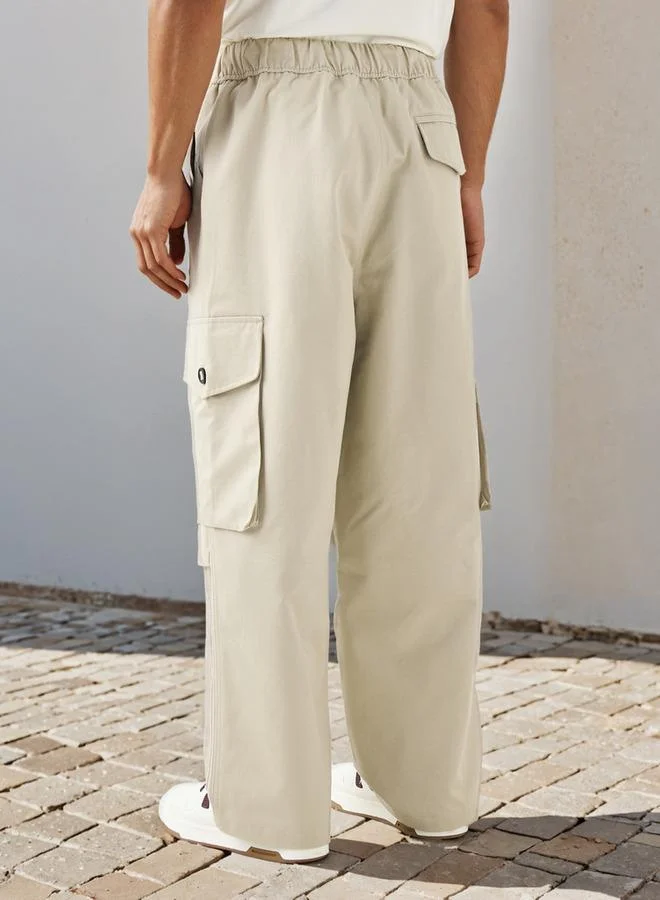 Lee Cooper  Lee Cooper Parachute Fit Pants with Button Closure and Pockets for Men | Best Price UAE