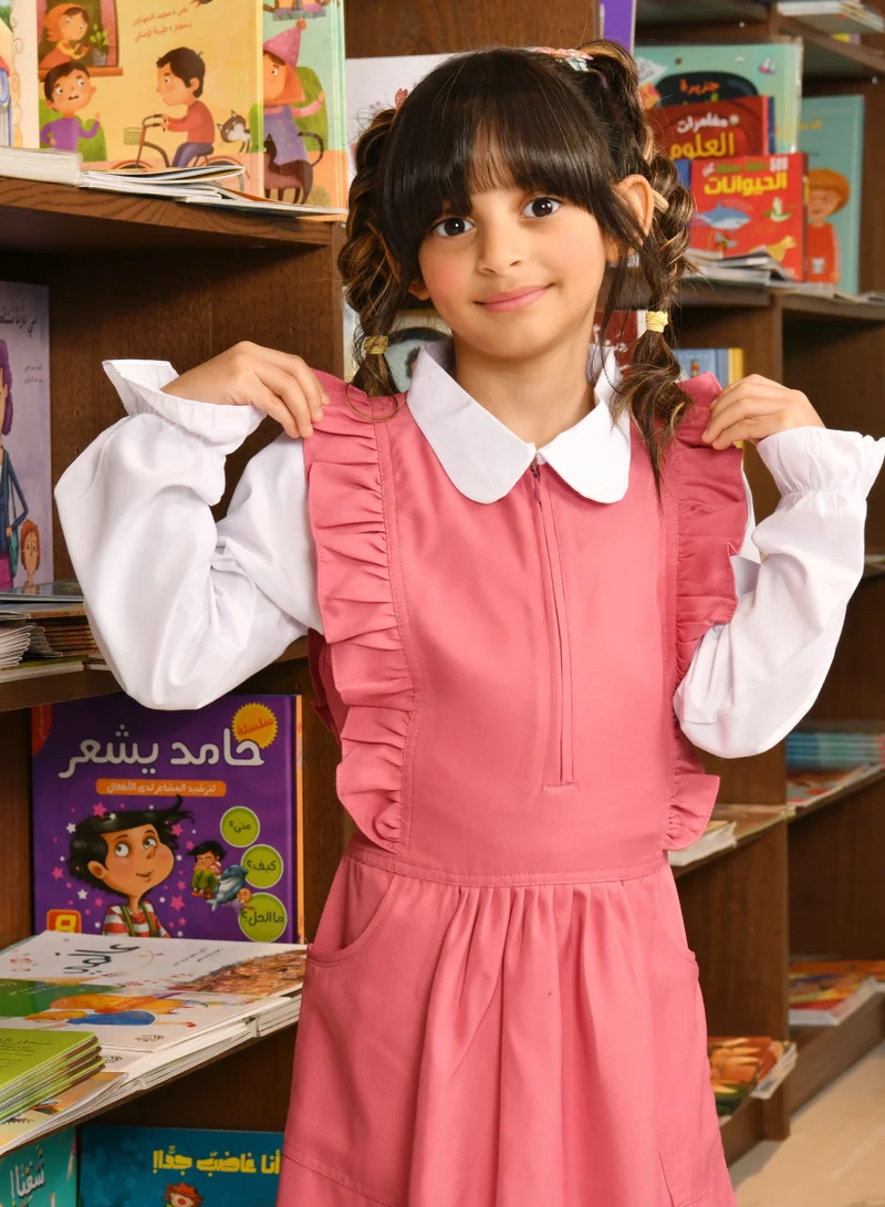 HAWRAA ABAYA Pink apron with long sleeves, ruffles on the shoulders, a zipper closure on the front, pleats at the bottom, and a tightening tie