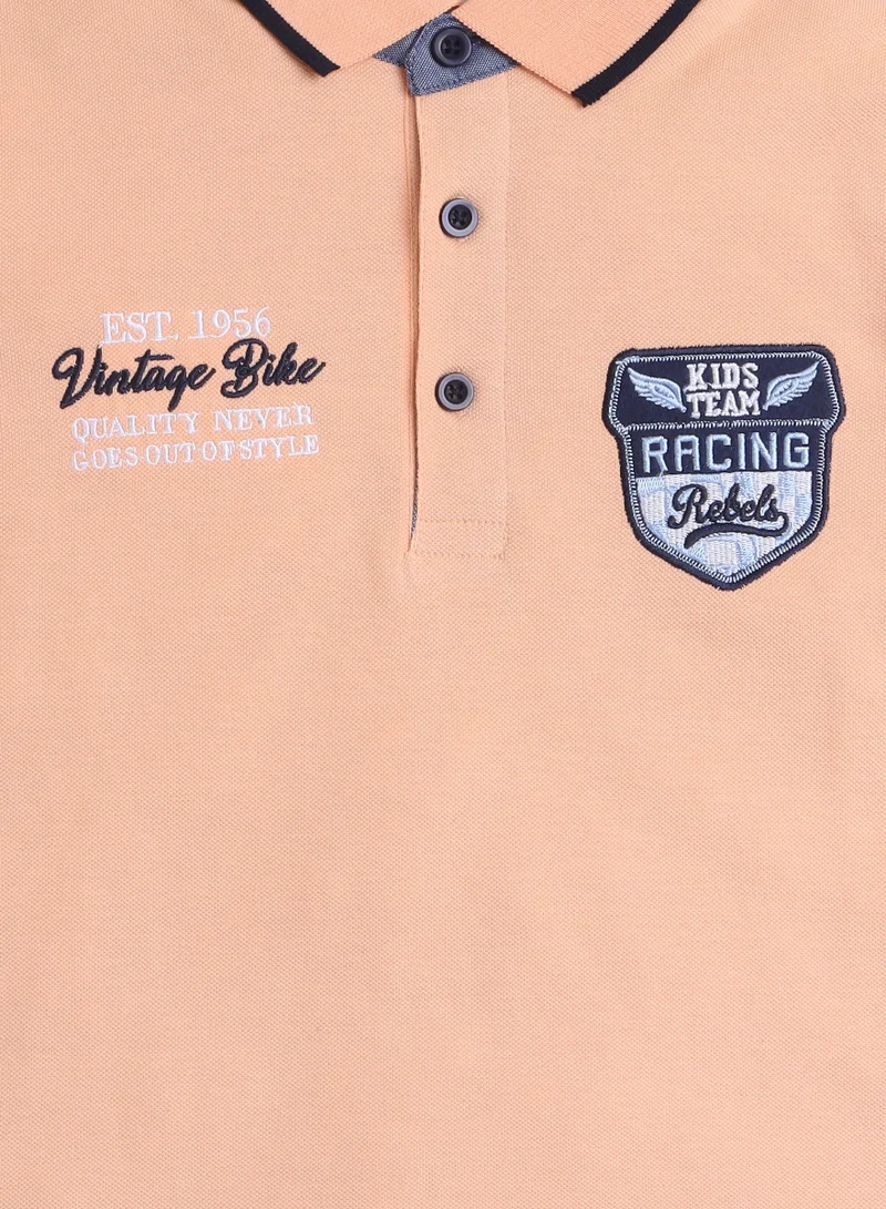 victor and jane Victor & Jane Senior Boys' Polo T-Shirt – Orange colour with Embroidered Label Detail