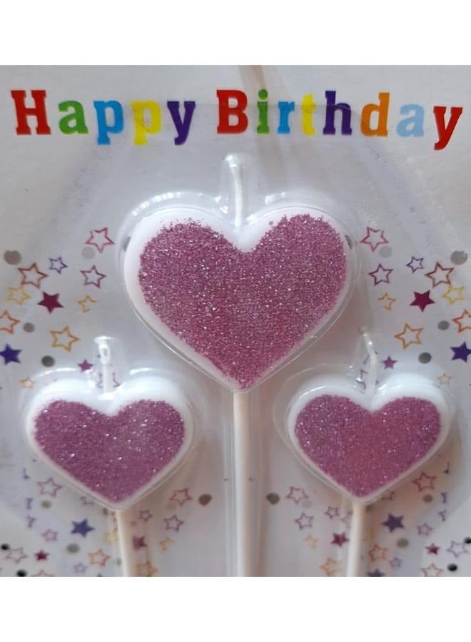 شمعة عيد ميلاد على شكل قلب باللونين الوردي والأبيض