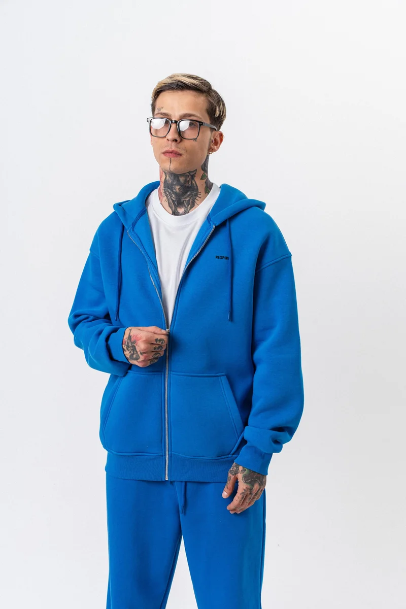 ريسباير هودي رجالي أساسي واسع (Oversize) بسحاب (Zip) بغطاء رأس بتفاصيل نص "Respire" لون أزرق