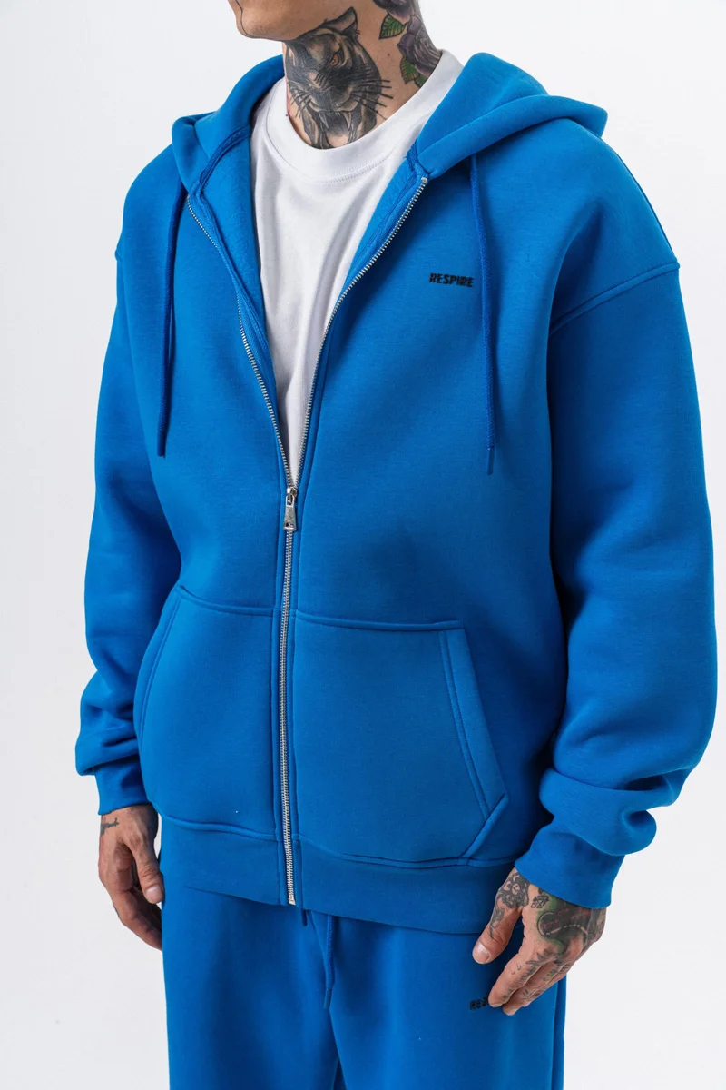 ريسباير هودي رجالي أساسي واسع (Oversize) بسحاب (Zip) بغطاء رأس بتفاصيل نص "Respire" لون أزرق