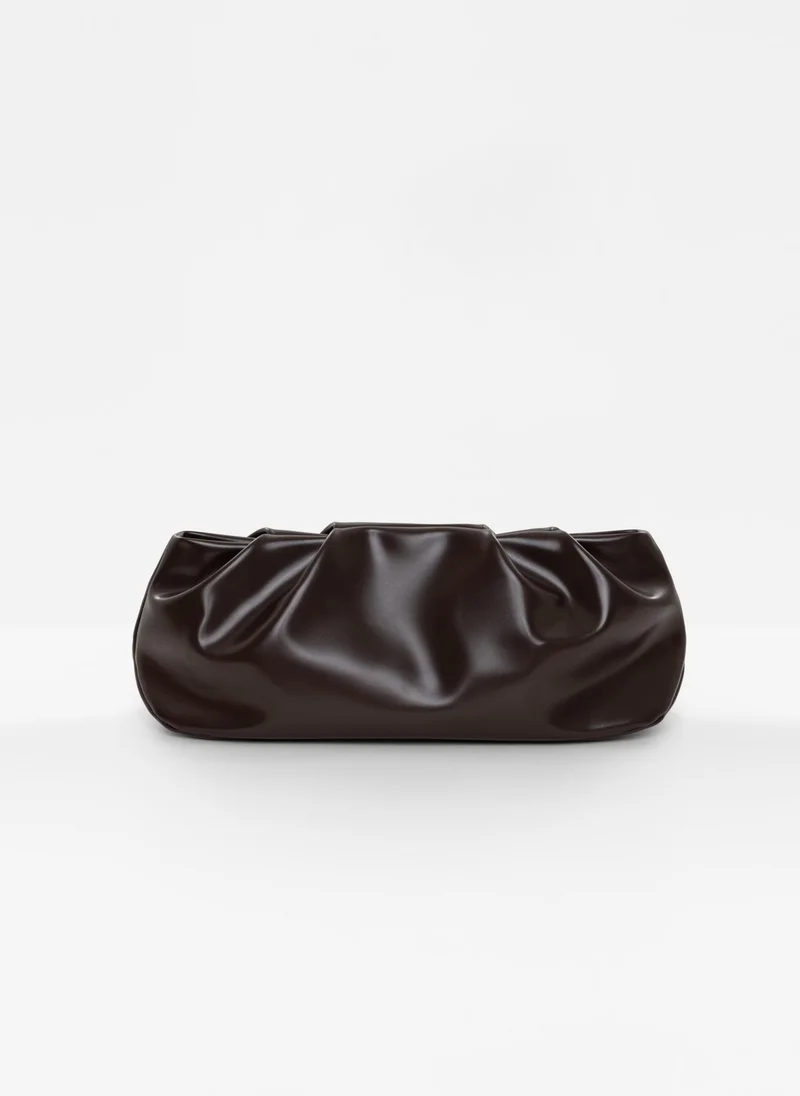 Lichi Voluminous eco-leather clutch bag with a thin strap