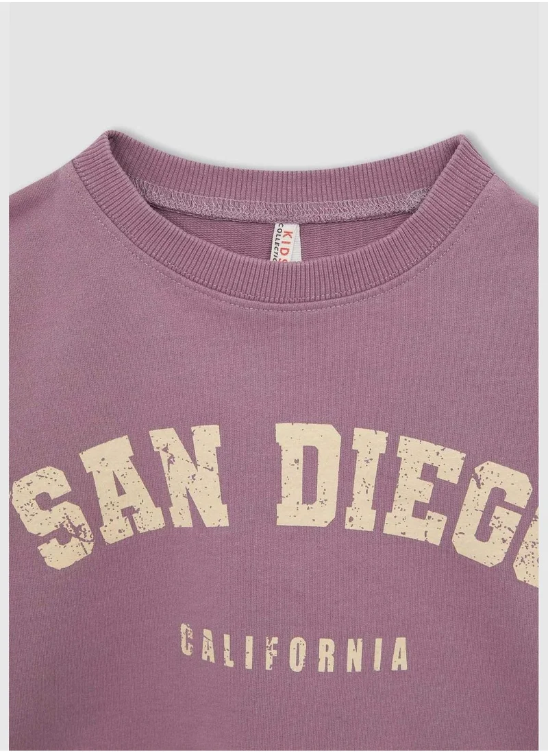 ديفاكتو Long Sleeve San Diego Print Crop Sweatshirt