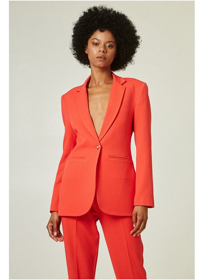 Tailored blazer with bejeweled button