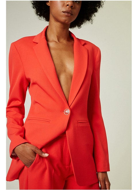 Tailored blazer with bejeweled button